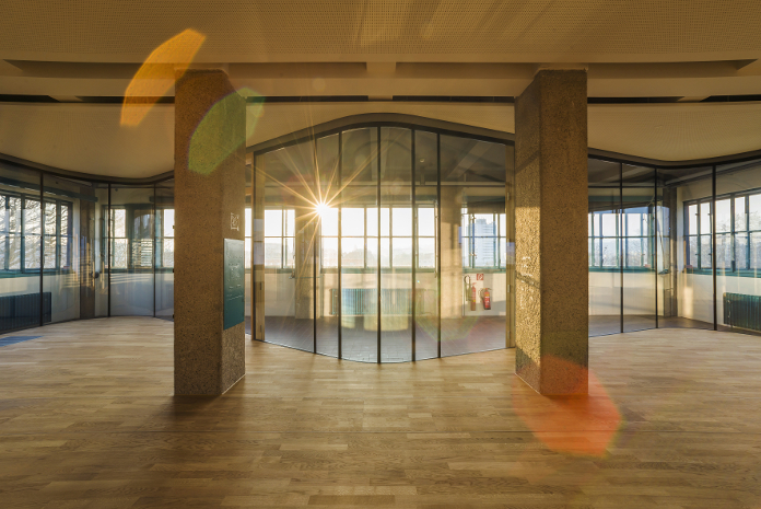 Revitalisierung des Bau 2 (heute Haus DAMES) mittels „Box-in-Box“-Konzept hinter der denkmalgeschützten Gebäudehülle ab 2013.